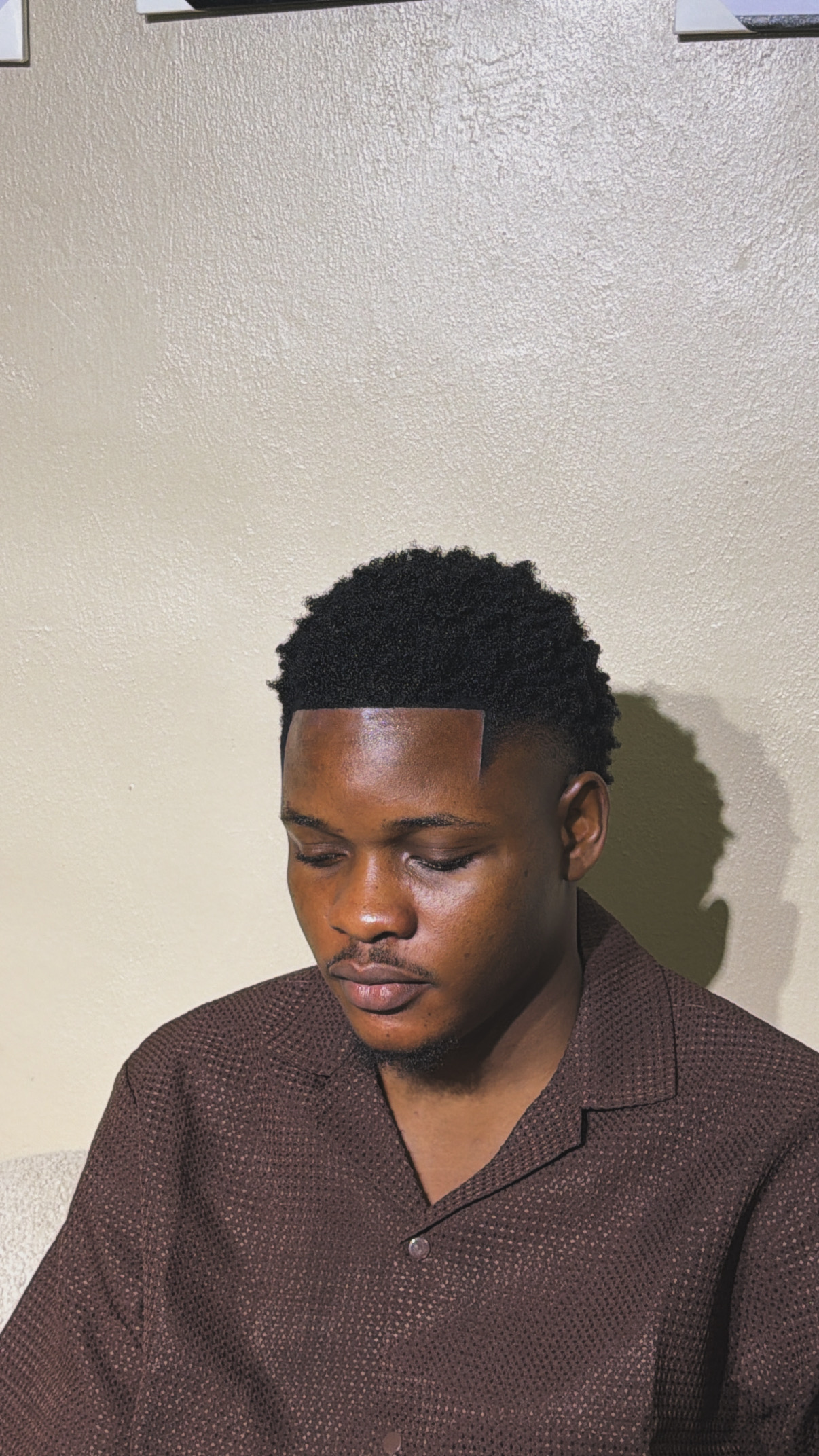 Textured haircut with a clean, sharp lineup